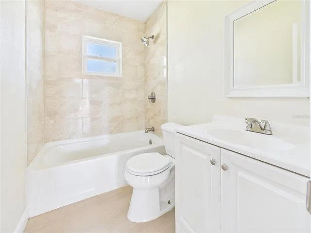 a bathroom with a sink a toilet and a bathtub