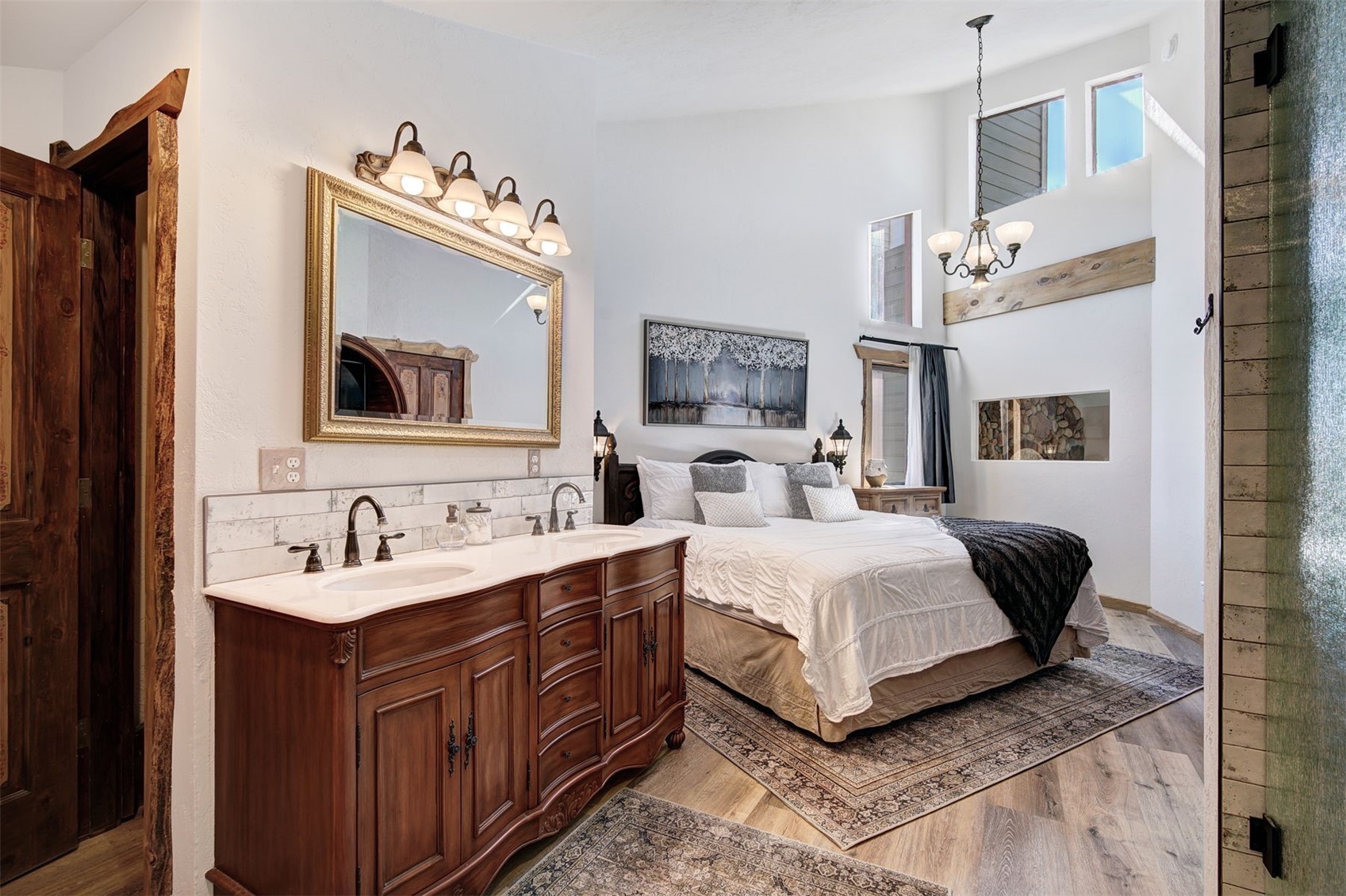 9460 Ryan Gulch Road, Unit 9460 Silverthorne, CO 80498 - Photo 15 of 39 a bedroom with a bed mirror and window