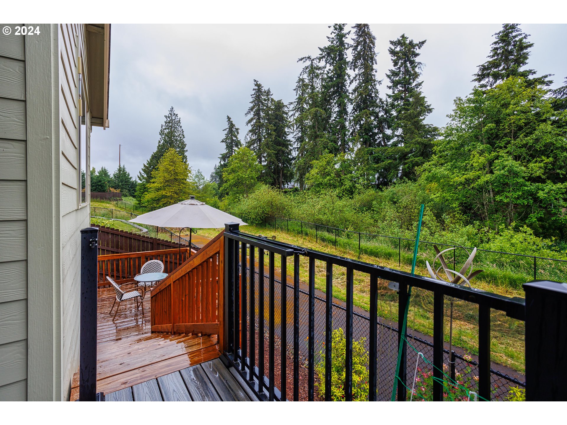 4313 North Ridgefield Woods Drive Ridgefield, WA 98642 - Photo 22 of 24 a view of a balcony with wooden floor and outdoor space