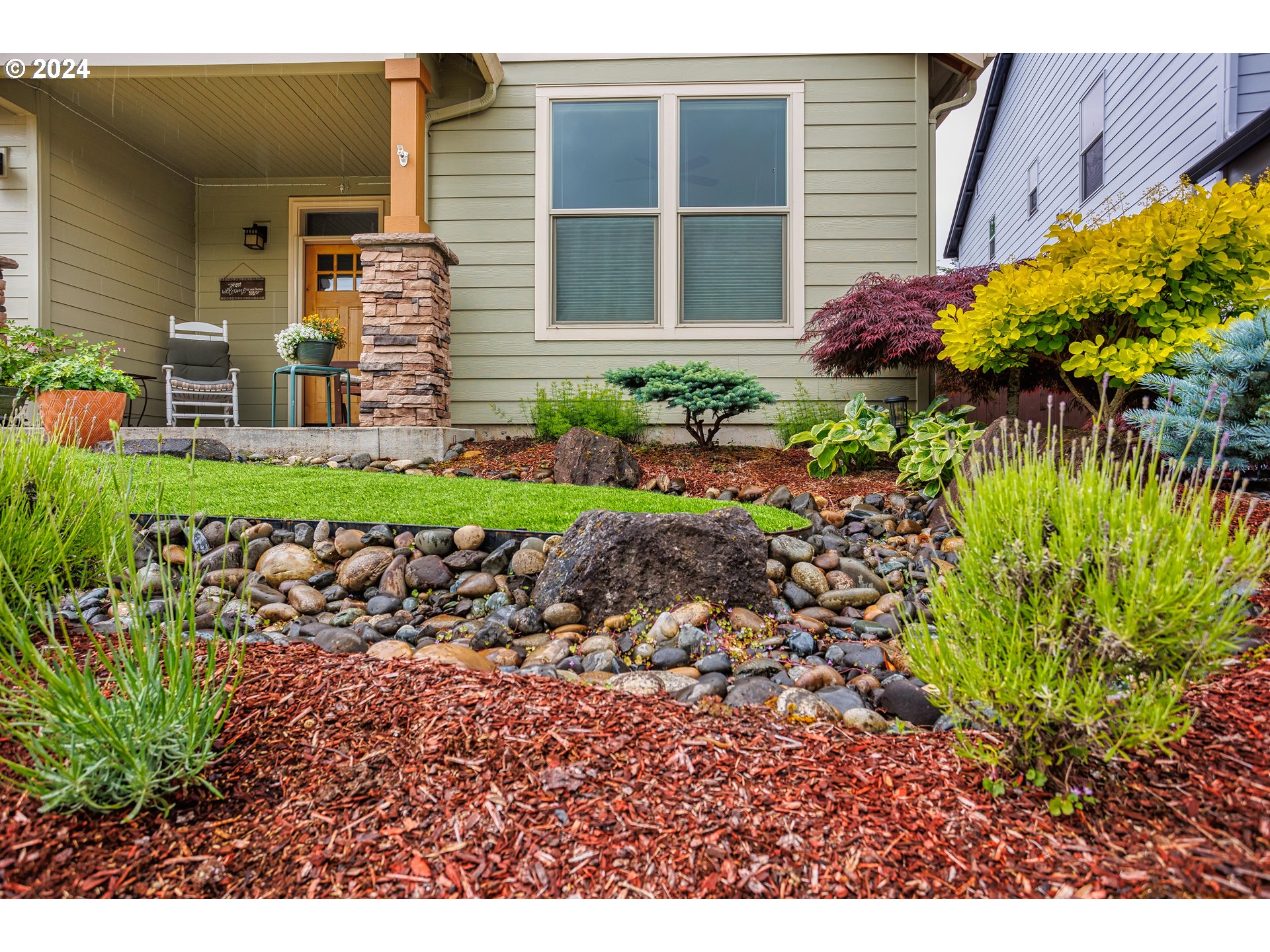 4313 North Ridgefield Woods Drive Ridgefield, WA 98642 - Photo 5 of 24 a view of a backyard with potted plants