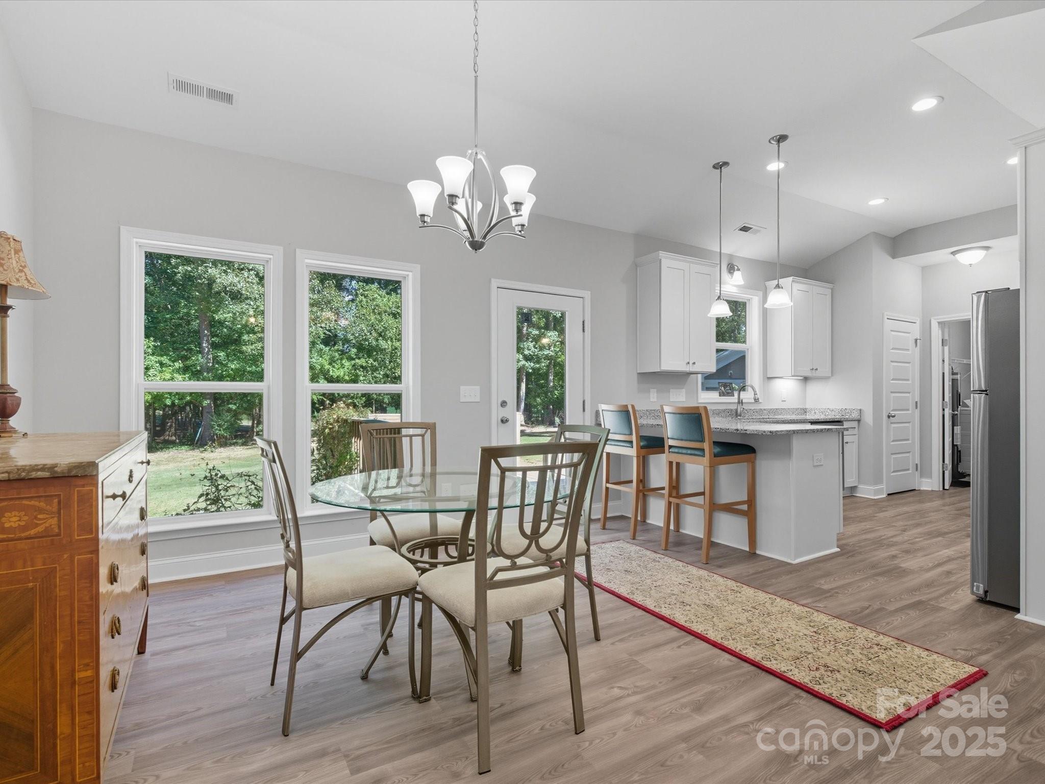 1830 Austin Chaney Road Wingate, NC 28174 - Photo 12 of 39 a view of a dining room with furniture window and wooden floor