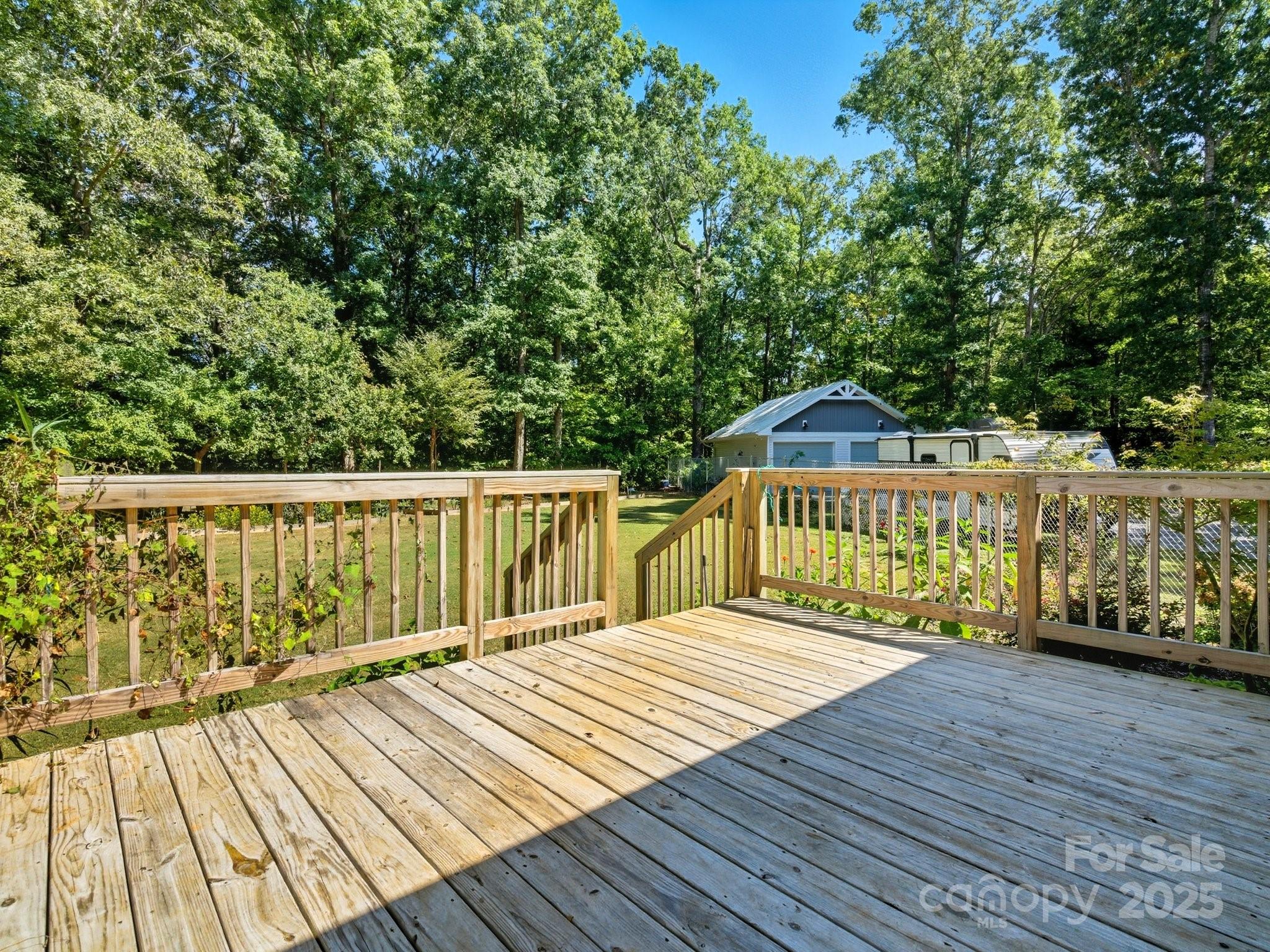 1830 Austin Chaney Road Wingate, NC 28174 - Photo 26 of 39 a balcony with wooden floor and fence