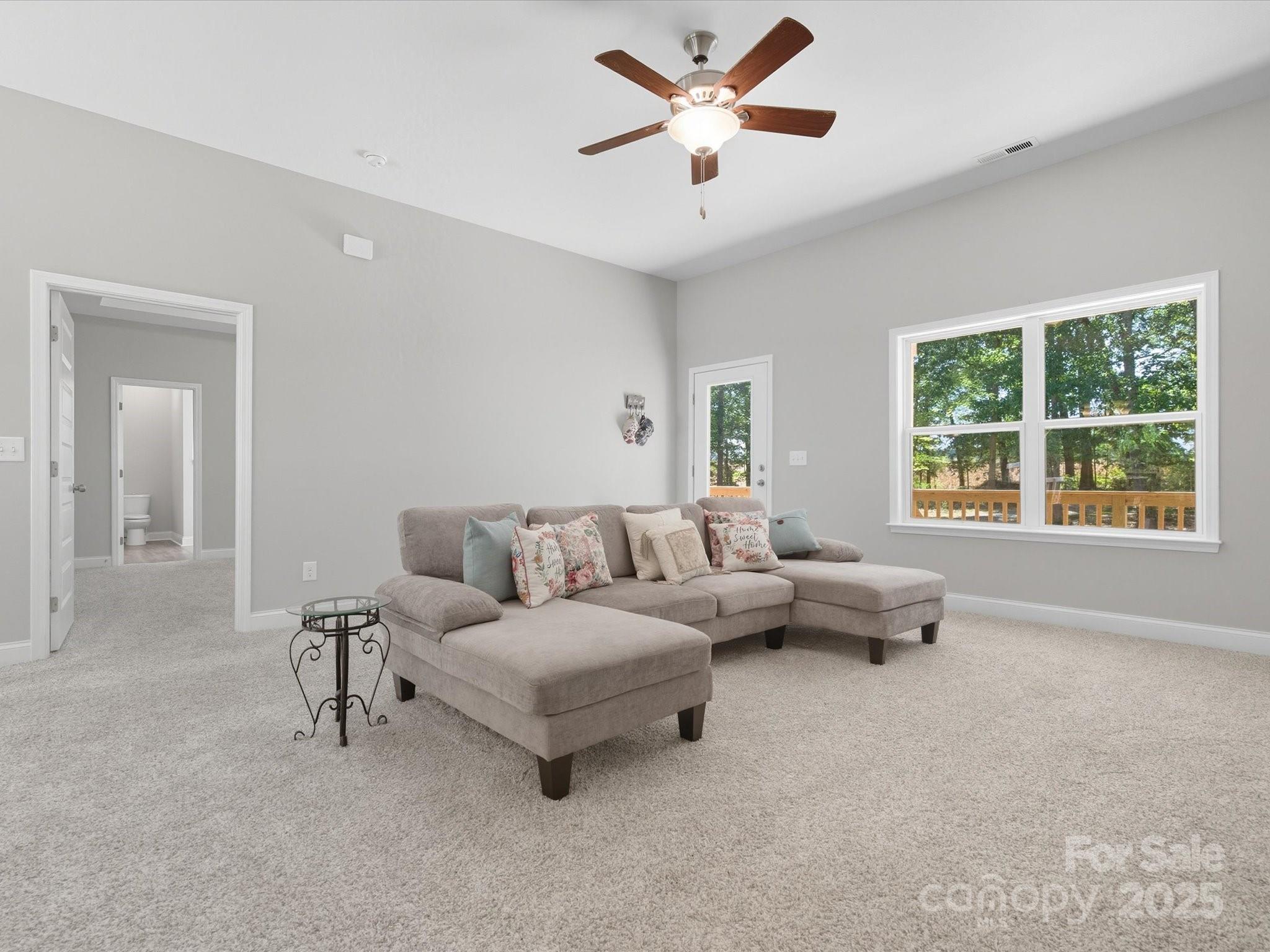 1830 Austin Chaney Road Wingate, NC 28174 - Photo 3 of 39 a living room with furniture and a large window