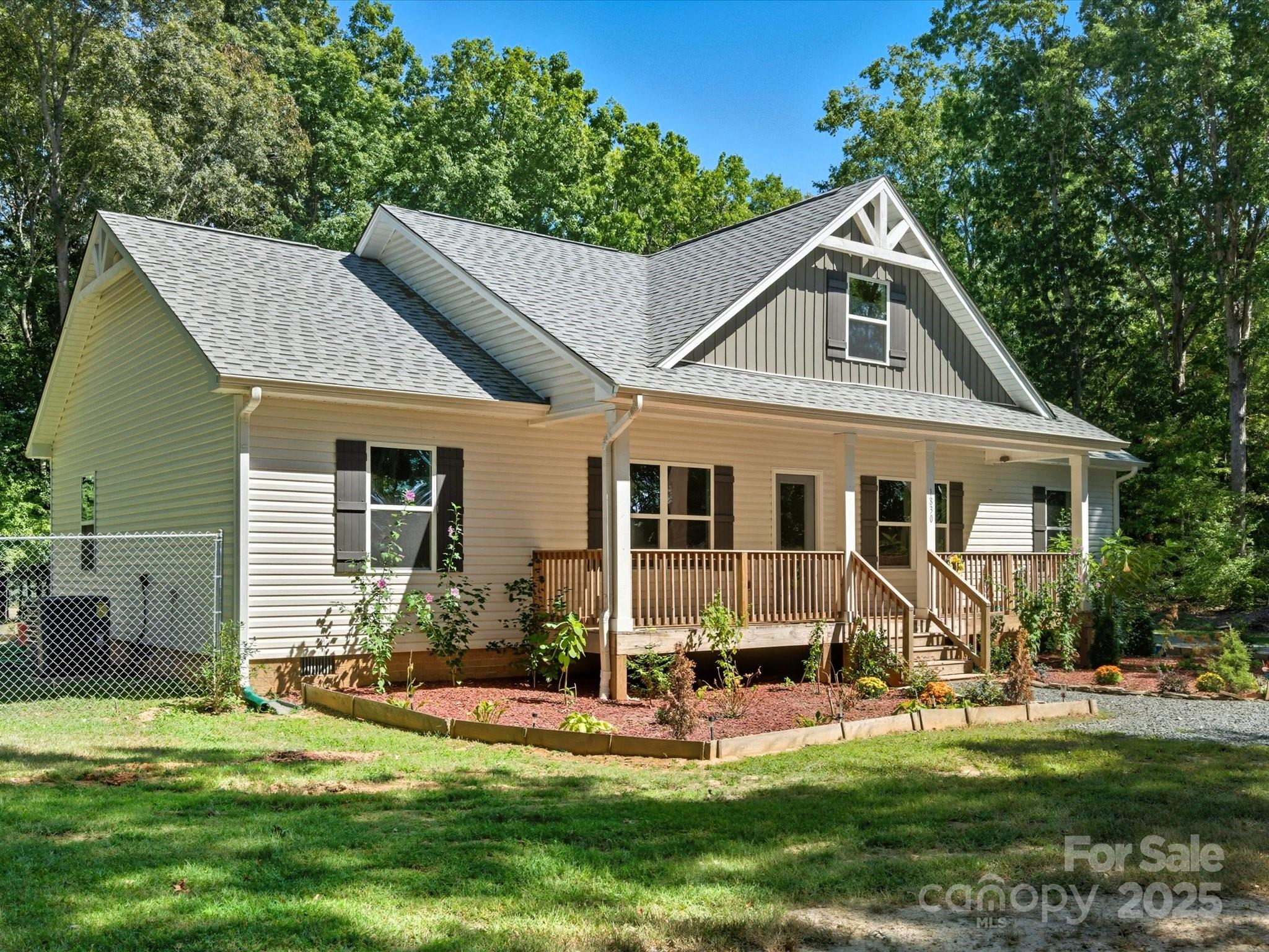 1830 Austin Chaney Road Wingate, NC 28174 - Photo 32 of 39 a view of a house with a yard patio and fire pit
