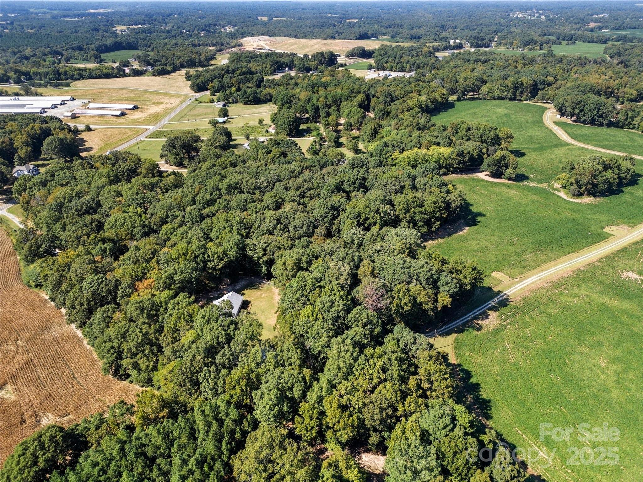 1830 Austin Chaney Road Wingate, NC 28174 - Photo 36 of 39 an aerial view of residential houses with outdoor space and trees