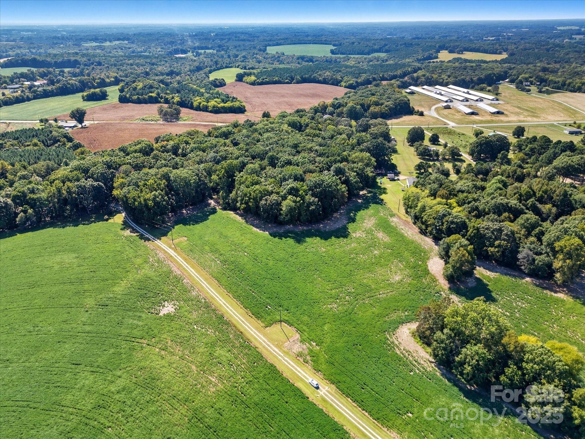 1830 Austin Chaney Road Wingate, NC 28174 - Photo 37 of 39 an aerial view of residential houses with outdoor space and trees