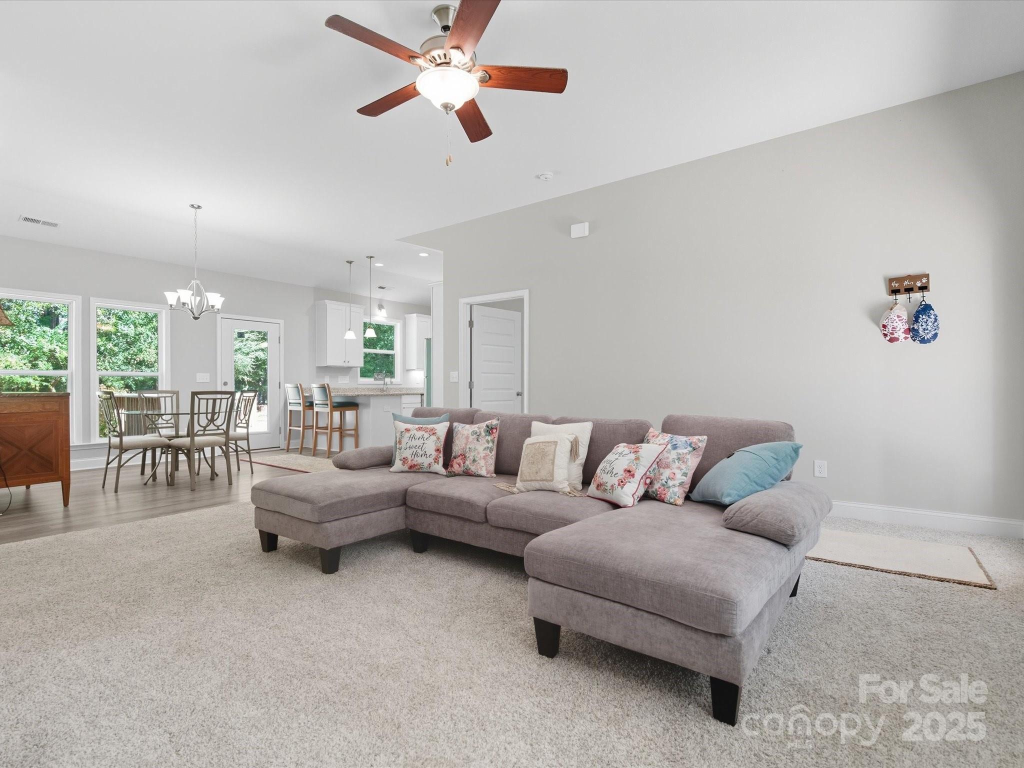 1830 Austin Chaney Road Wingate, NC 28174 - Photo 5 of 39 a living room with furniture and a chandelier