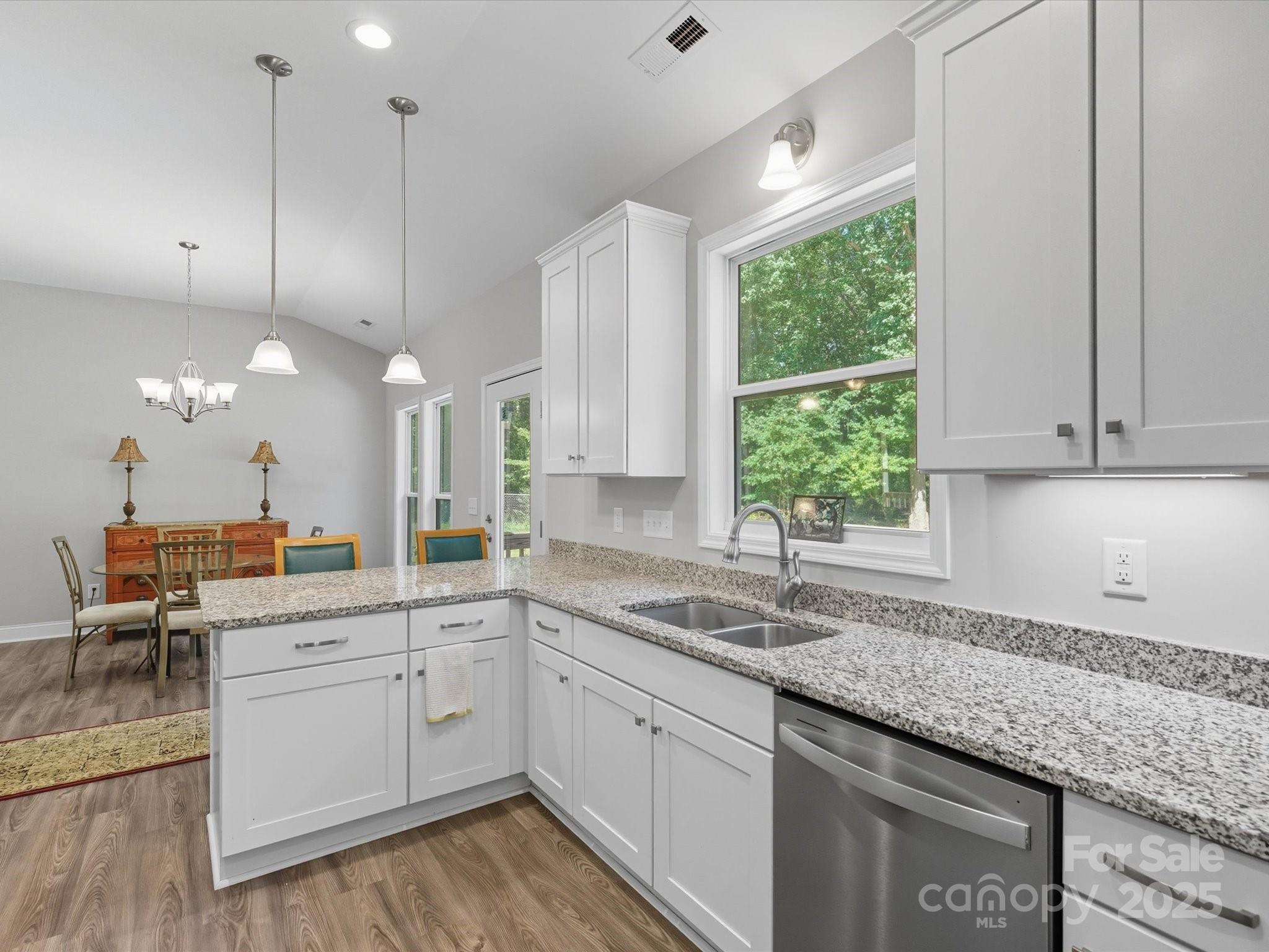 1830 Austin Chaney Road Wingate, NC 28174 - Photo 8 of 39 a kitchen with a sink window and cabinets