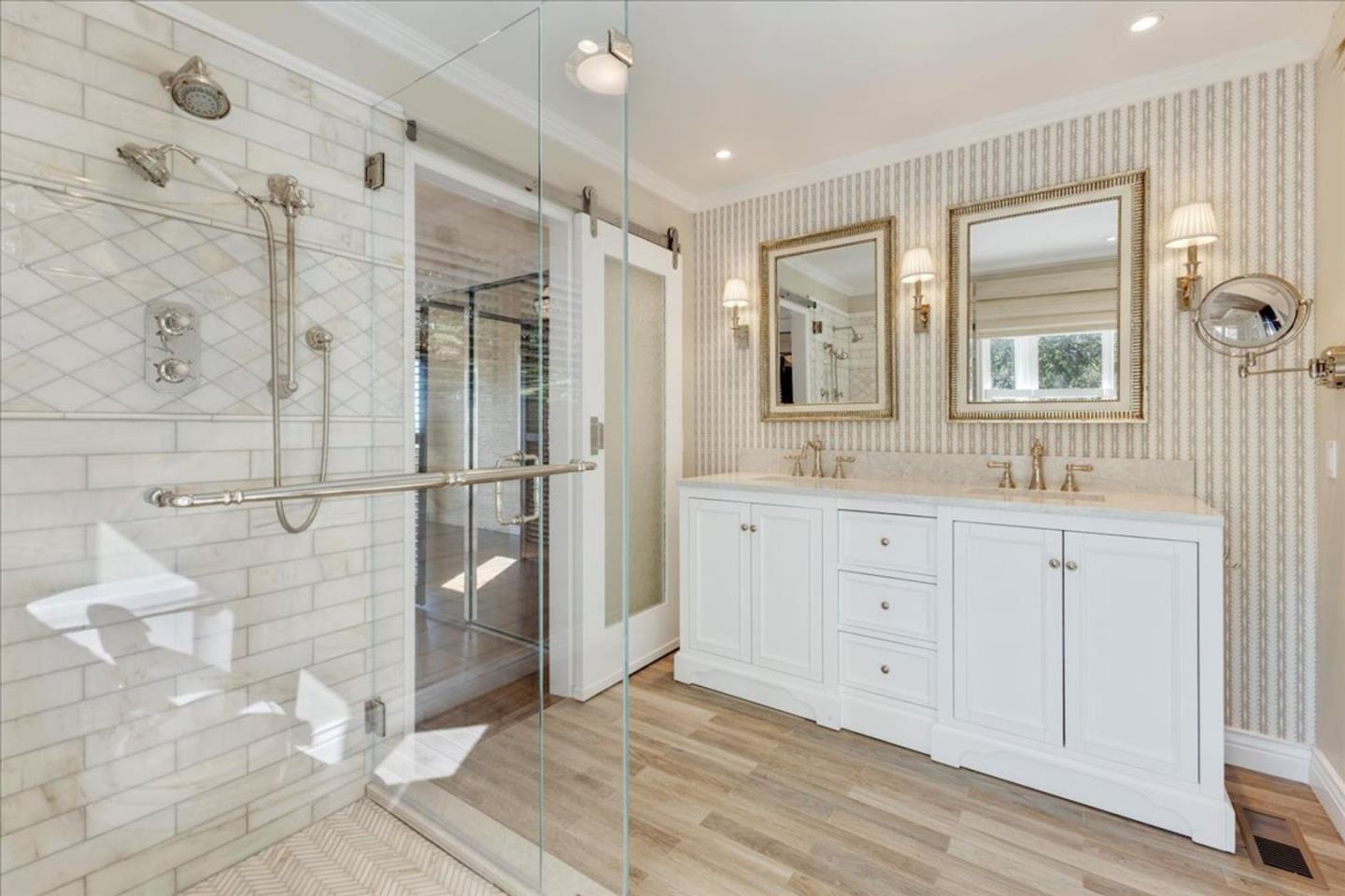 15 Mentone Road Carmel, CA 93923 - Photo 29 of 47 a bathroom with a granite countertop sink a mirror and shower
