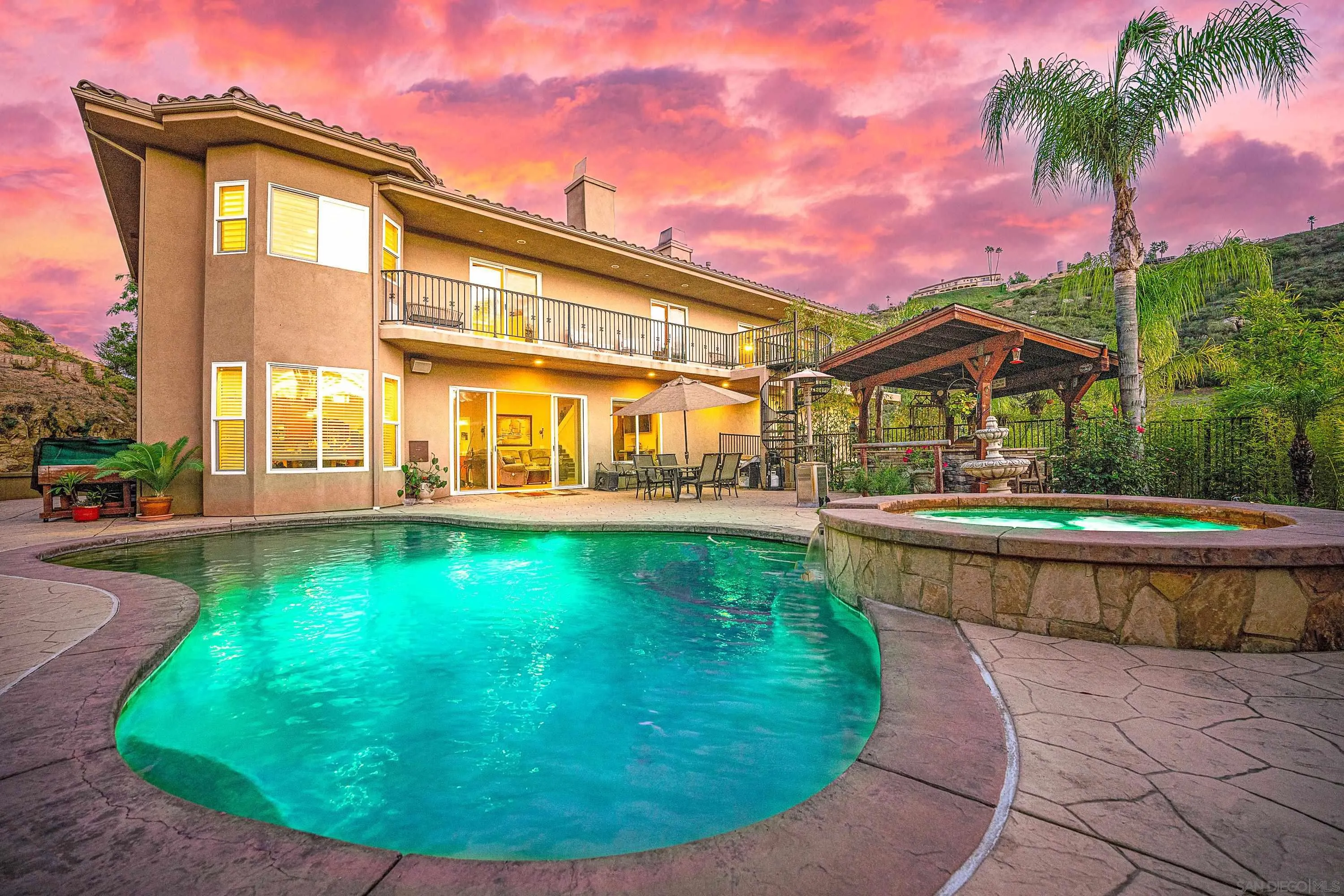 15380 Oak Canyon Road Poway, CA 92064 - Photo 1 of 52 a view of a swimming pool with a patio