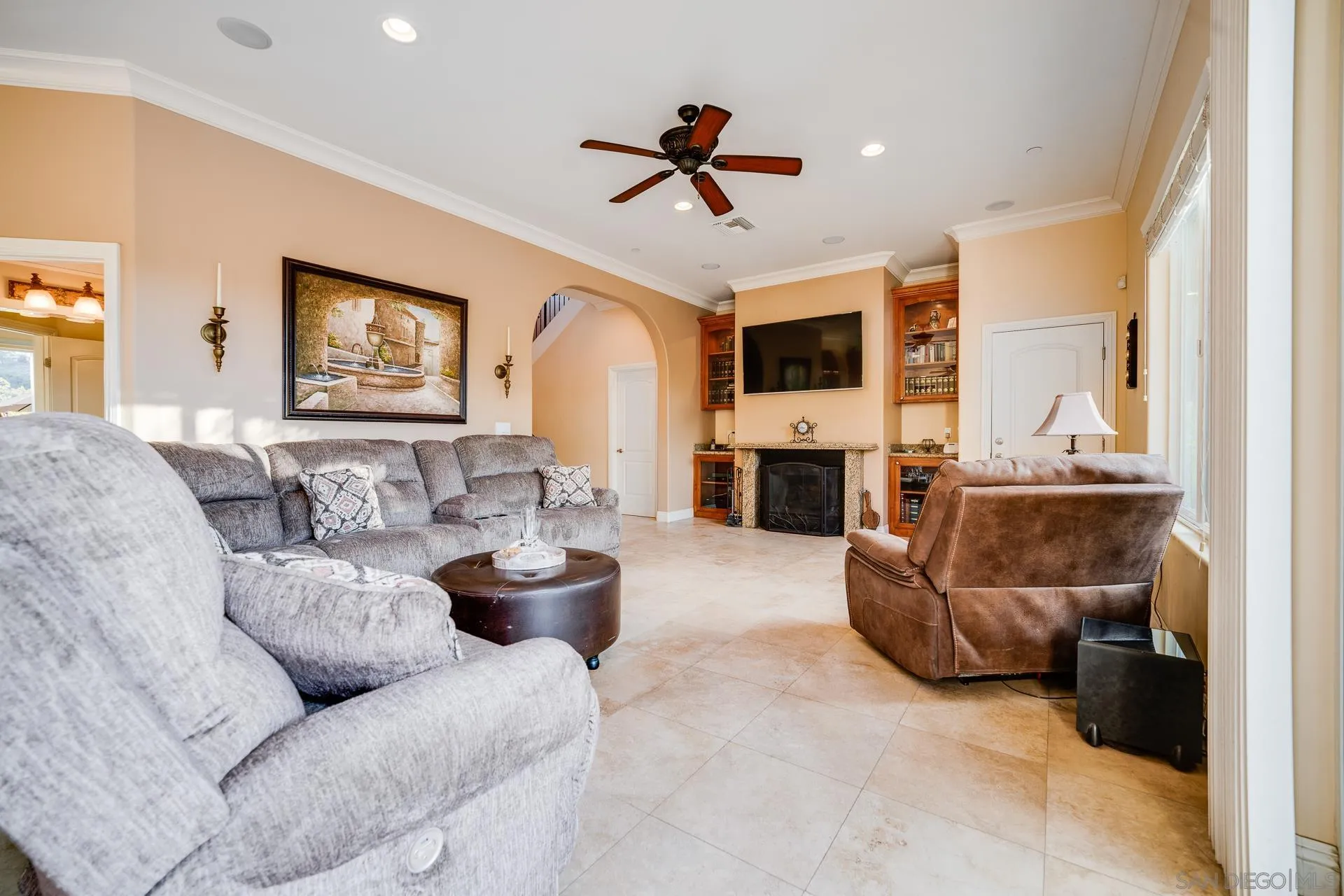 15380 Oak Canyon Road Poway, CA 92064 - Photo 15 of 52 a living room with furniture and a fireplace