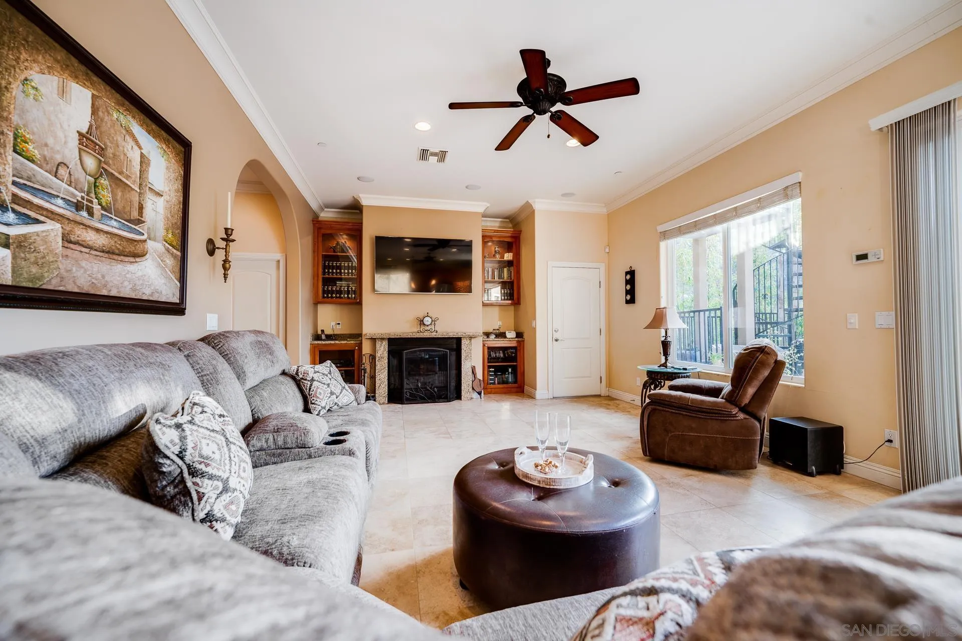 15380 Oak Canyon Road Poway, CA 92064 - Photo 16 of 52 a living room with furniture and a fireplace