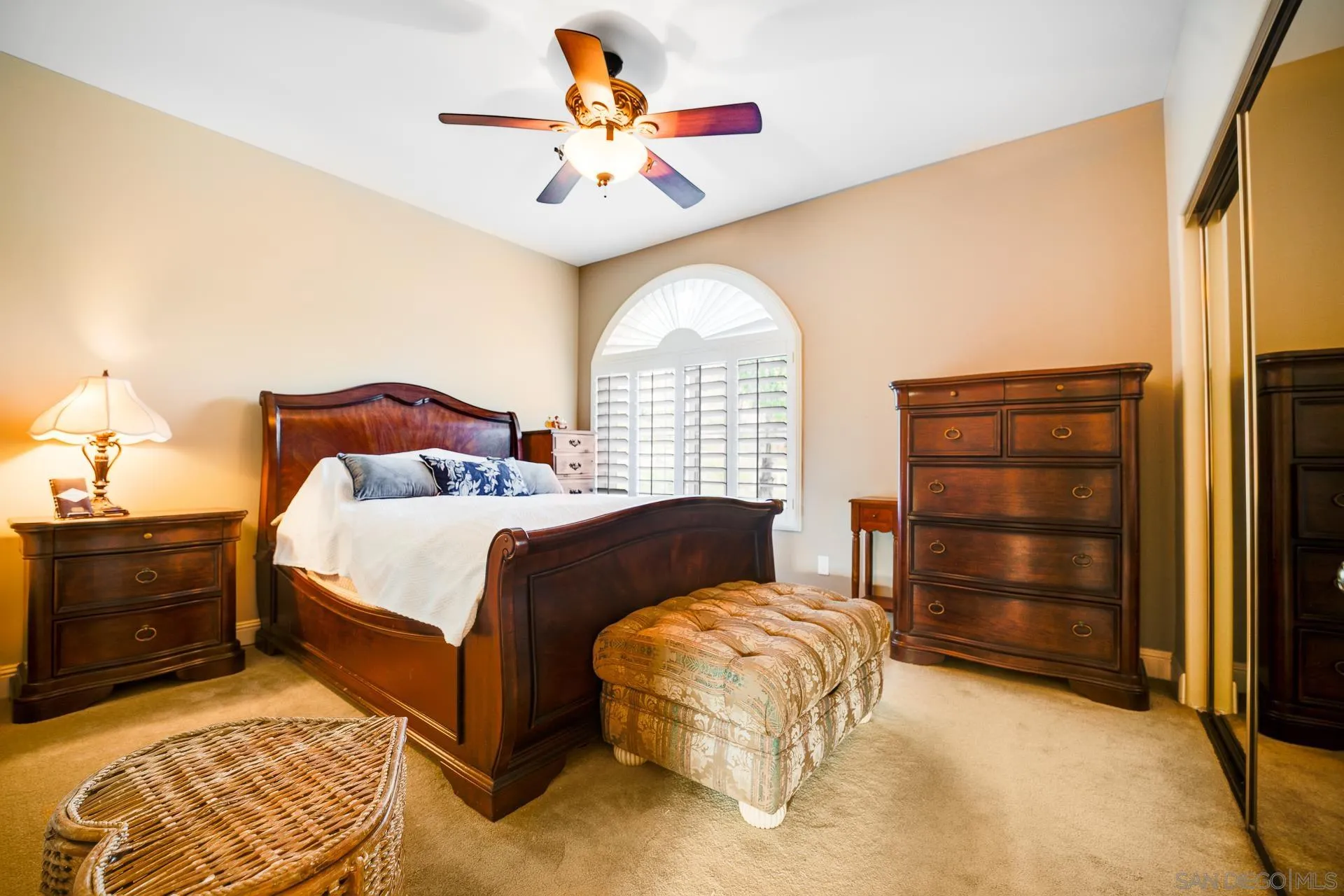 15380 Oak Canyon Road Poway, CA 92064 - Photo 23 of 52 a bedroom with a bed and a chandelier