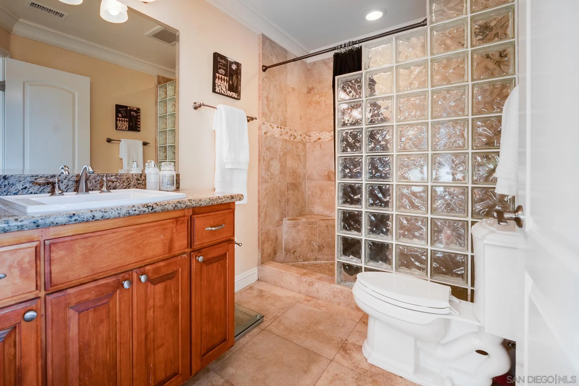 15380 Oak Canyon Road Poway, CA 92064 - Photo 24 of 52 a bathroom with a sink a toilet and shower