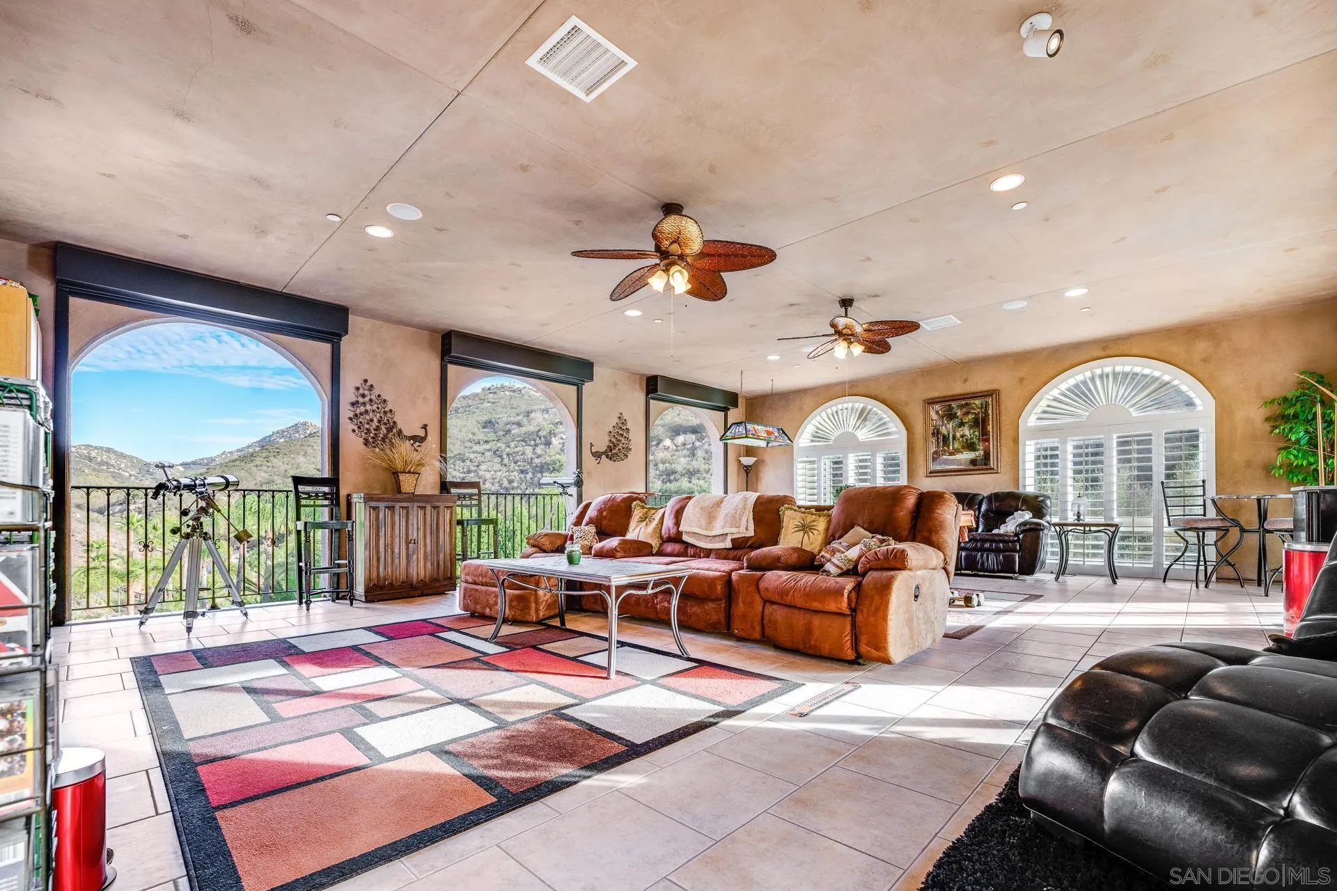15380 Oak Canyon Road Poway, CA 92064 - Photo 25 of 52 a living room with furniture a chandelier and a large window