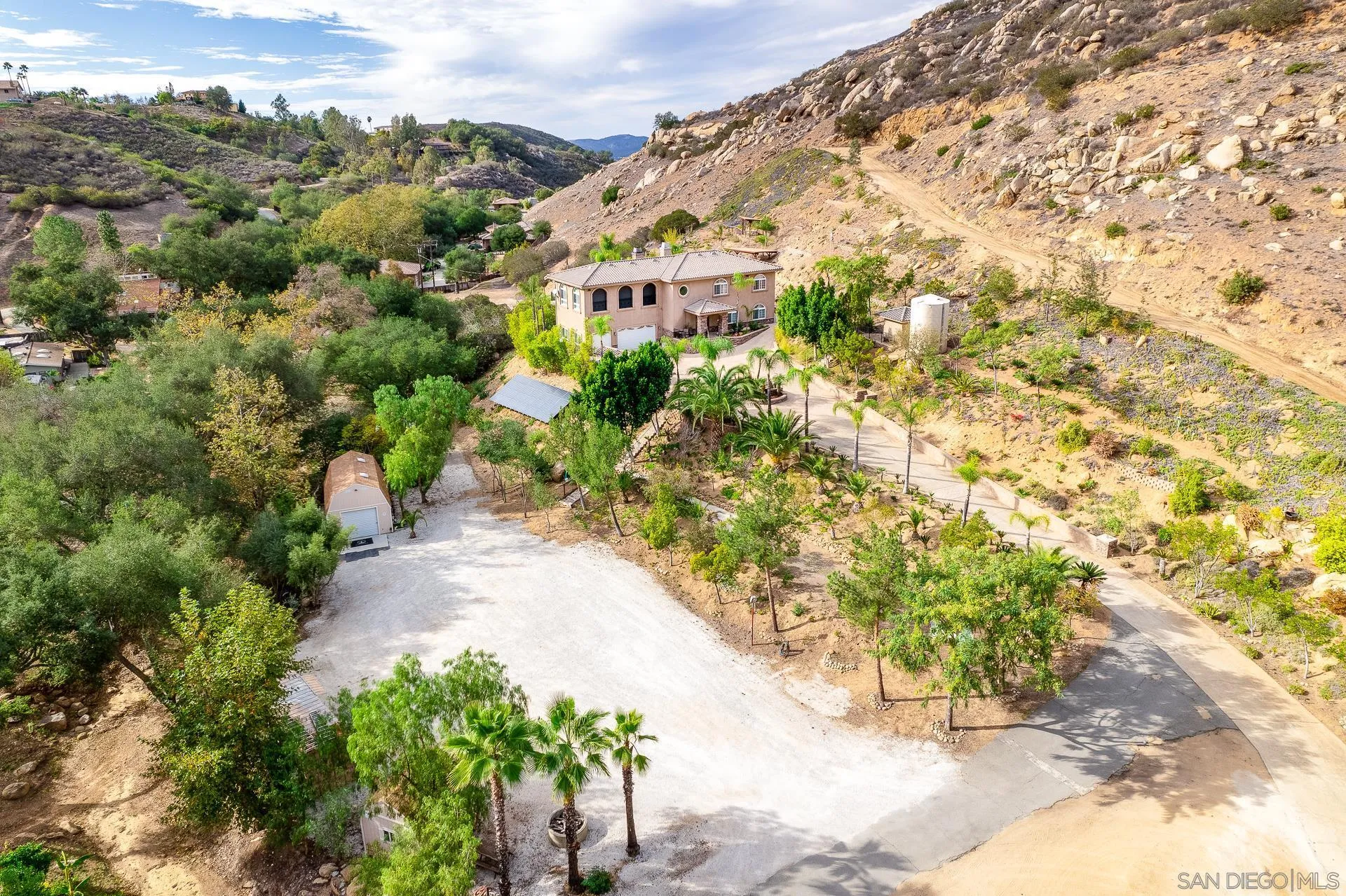 15380 Oak Canyon Road Poway, CA 92064 - Photo 37 of 52 a view of a large yard with plants and large trees