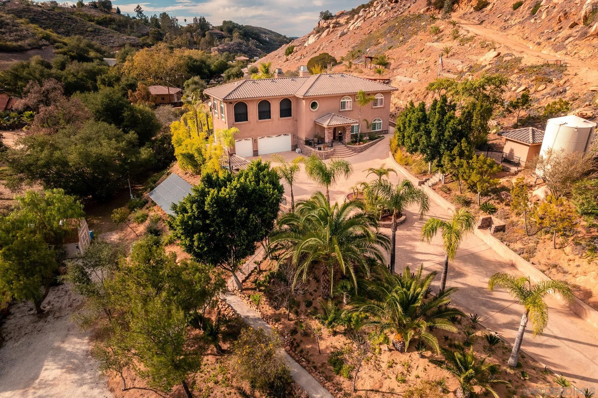 15380 Oak Canyon Road Poway, CA 92064 - Photo 51 of 52 a view of a house with a yard