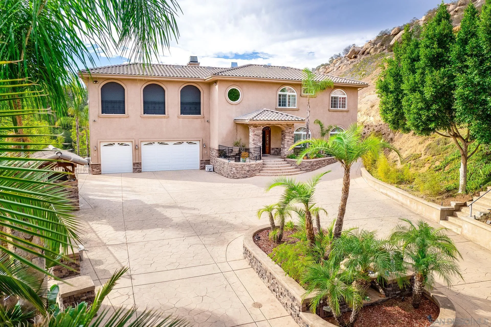 15380 Oak Canyon Road Poway, CA 92064 - Photo 7 of 52 a front view of a house with garden