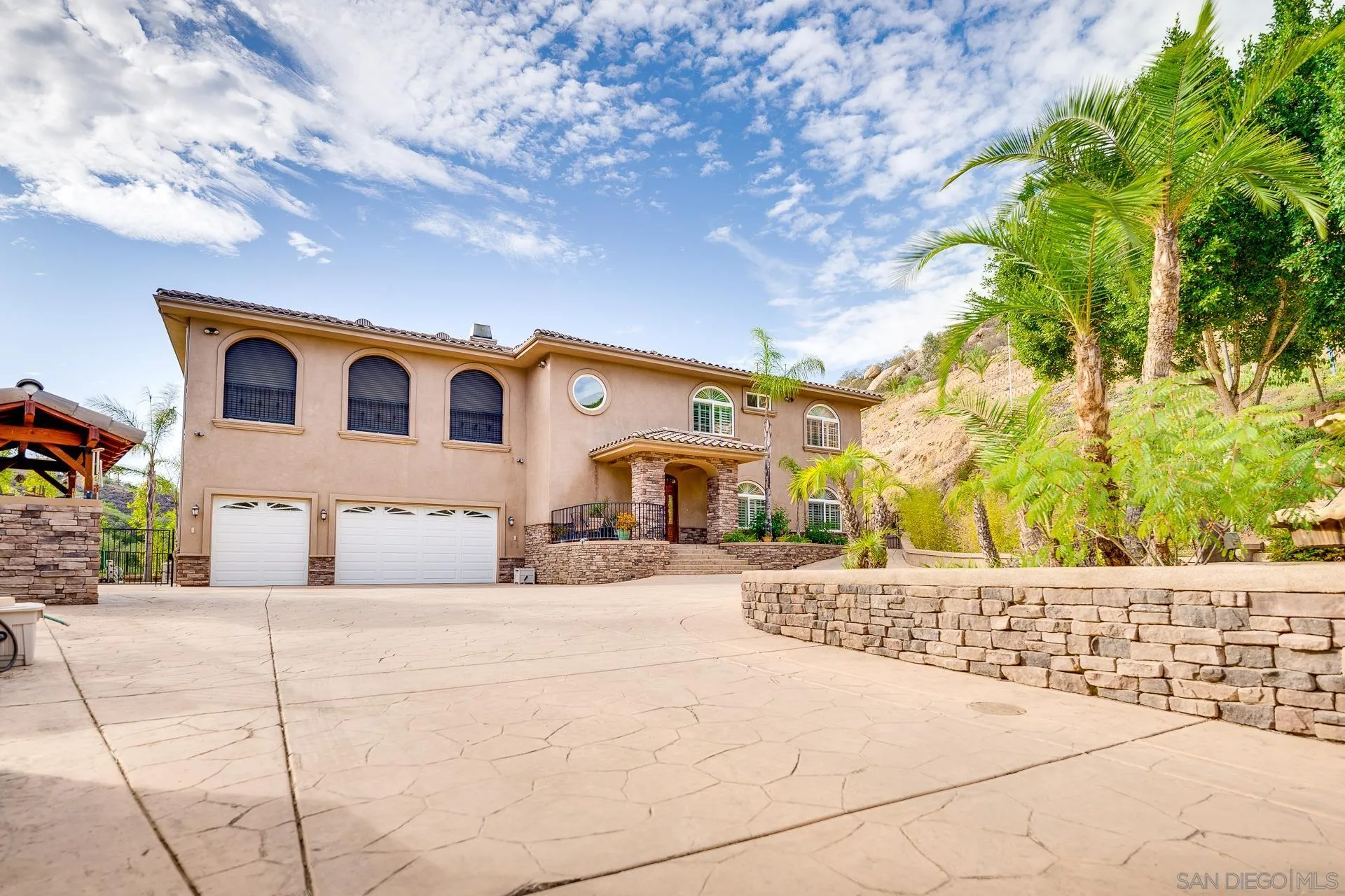 15380 Oak Canyon Road Poway, CA 92064 - Photo 10 of 52 a front view of a house with a yard