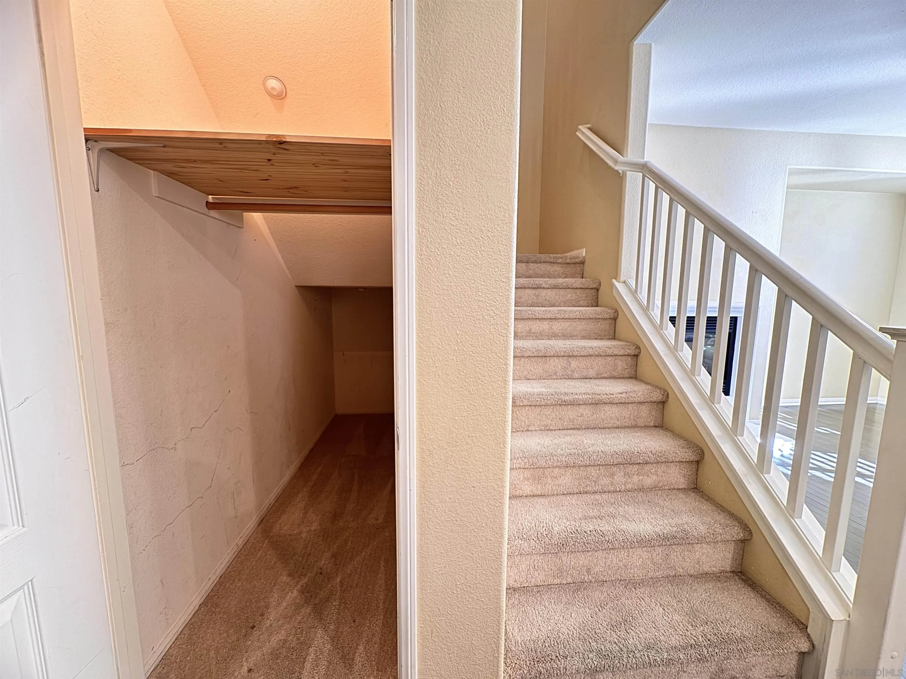 10430 Shelborne Street, Unit 37 San Diego, CA 92127 - Photo 11 of 27 a view of staircase with railing and white walls