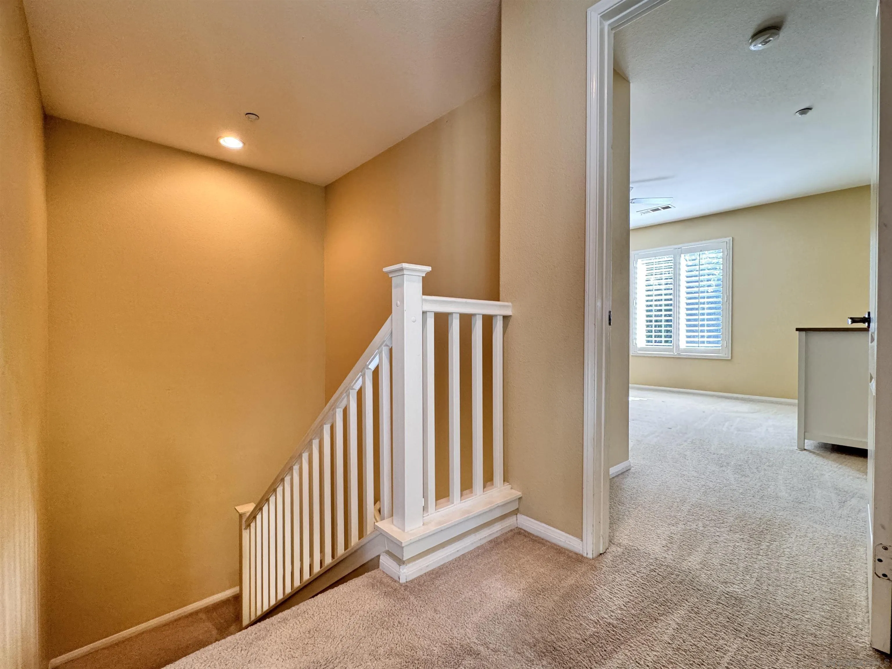 10430 Shelborne Street, Unit 37 San Diego, CA 92127 - Photo 13 of 27 a view of a hallway with entryway and stairs