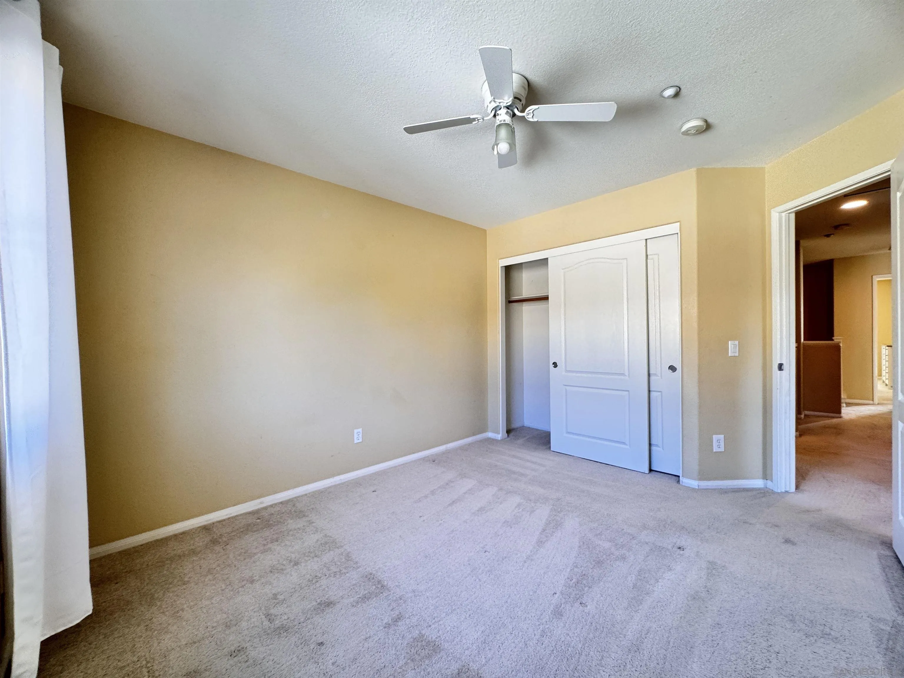 10430 Shelborne Street, Unit 37 San Diego, CA 92127 - Photo 14 of 27 a view of a room with a ceiling fan
