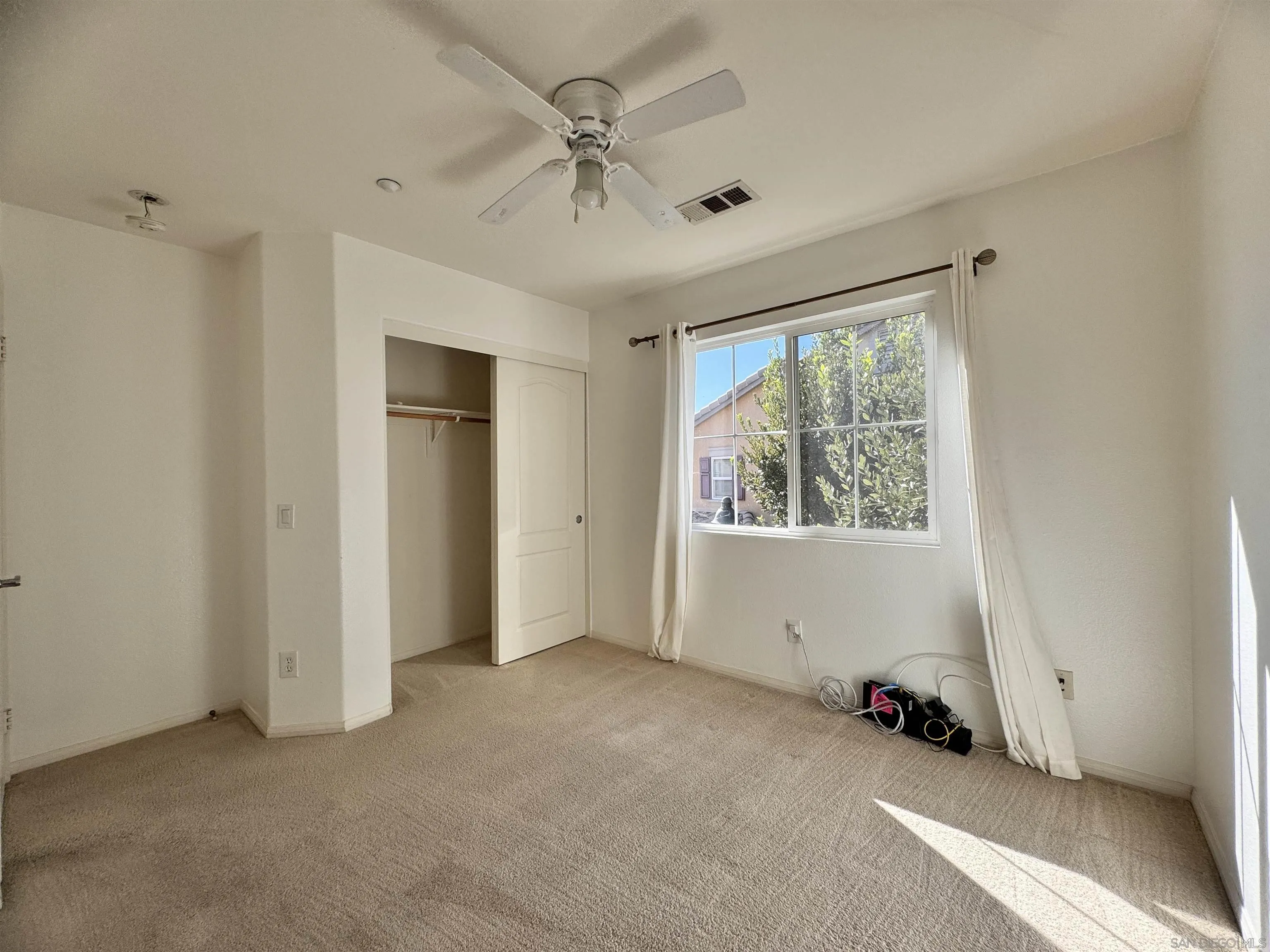 10430 Shelborne Street, Unit 37 San Diego, CA 92127 - Photo 17 of 27 a view of an empty room with a window