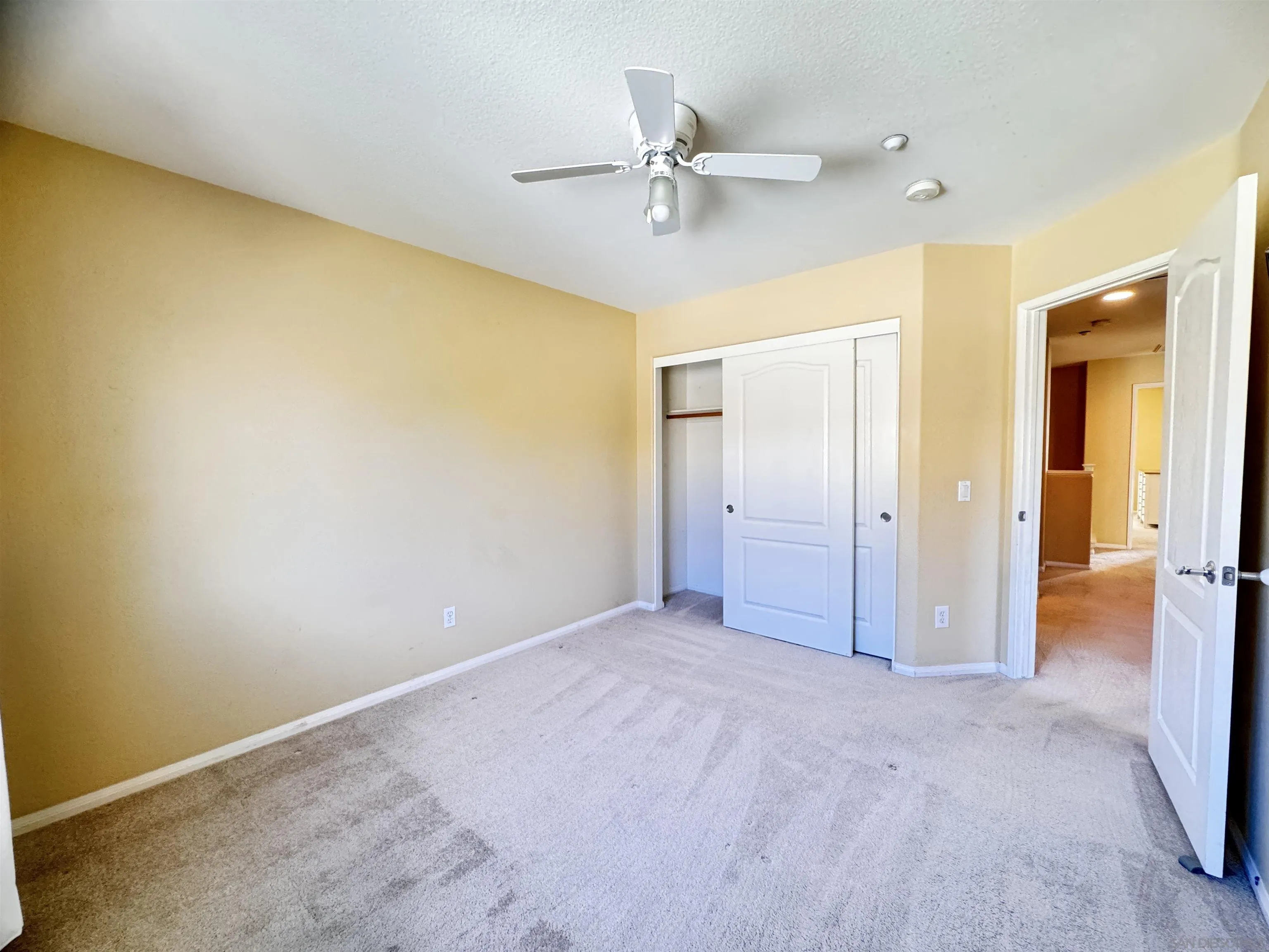 10430 Shelborne Street, Unit 37 San Diego, CA 92127 - Photo 26 of 27 wooden floor in an empty room and a ceiling fan