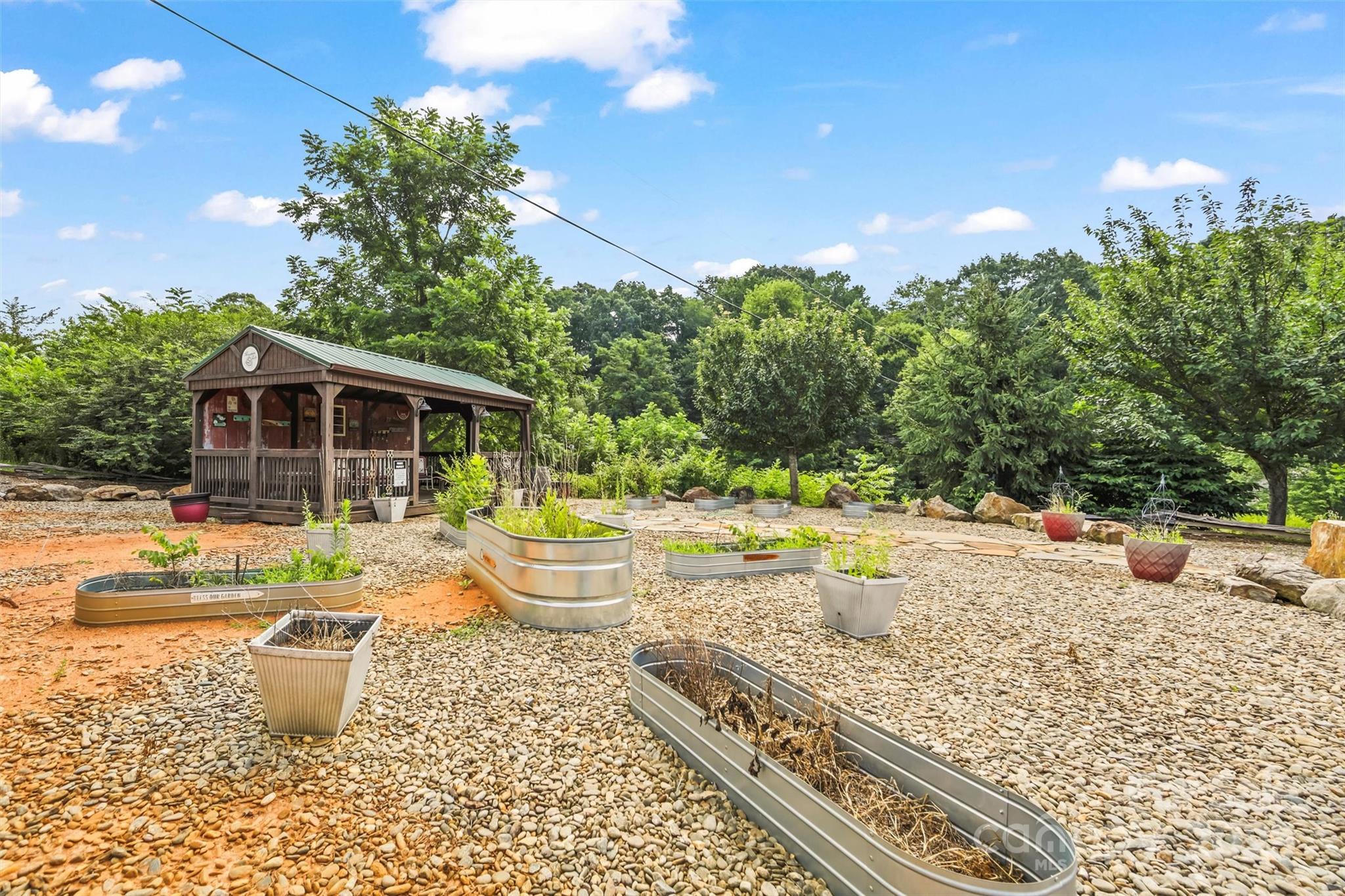 9999 Blue Ridge View Drive Canton, NC 28716 - Photo 12 of 18 a view of a house with backyard and sitting area