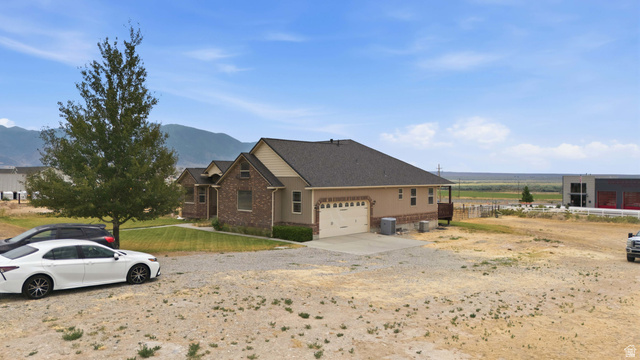 2567 West Rim Rock Drive Stockton, UT 84071 - Photo 55 of 64 Two-story residence featuring brick and siding exterior construction
