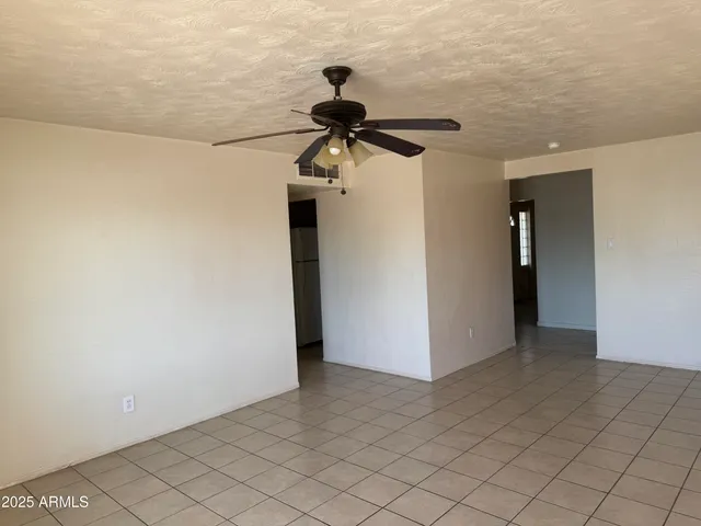 a kitchen with a refrigerator sink and cabinets
