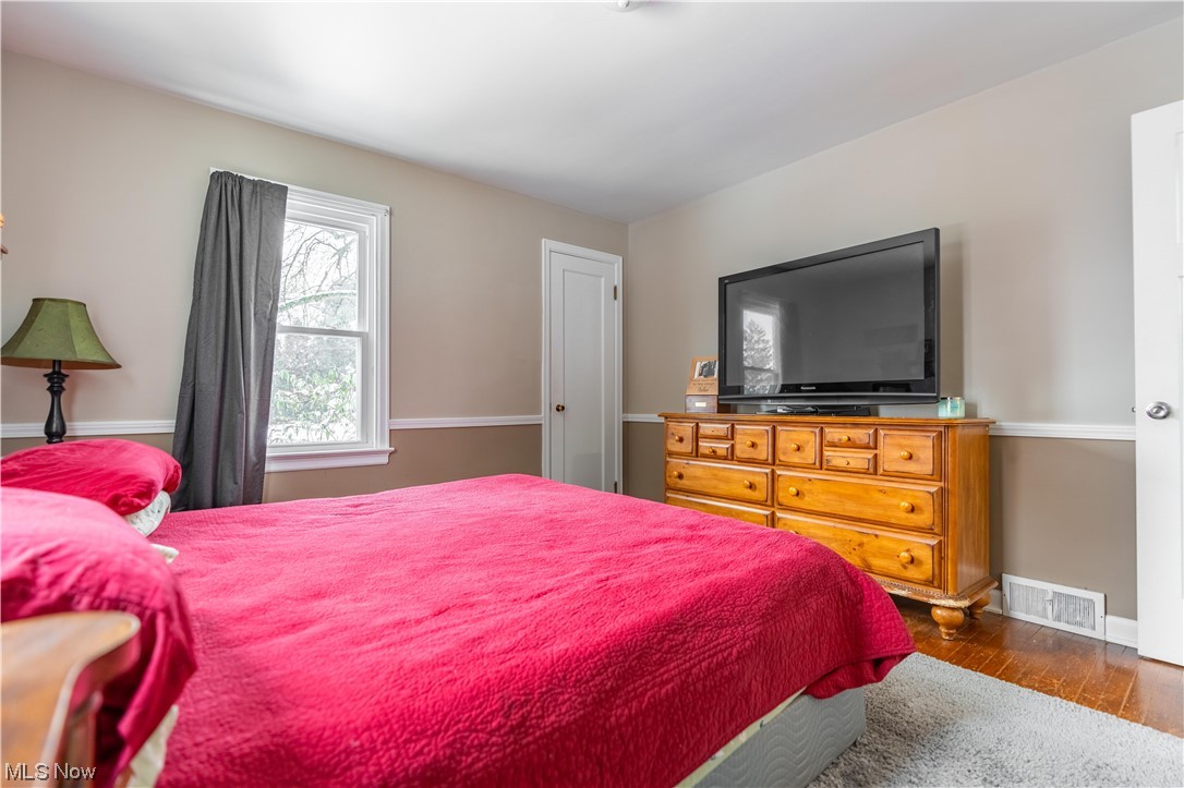 157 Everhard Road Southwest North Canton, OH 44720 - Photo 18 of 37 Bedroom on 1st floor with hardwood floors