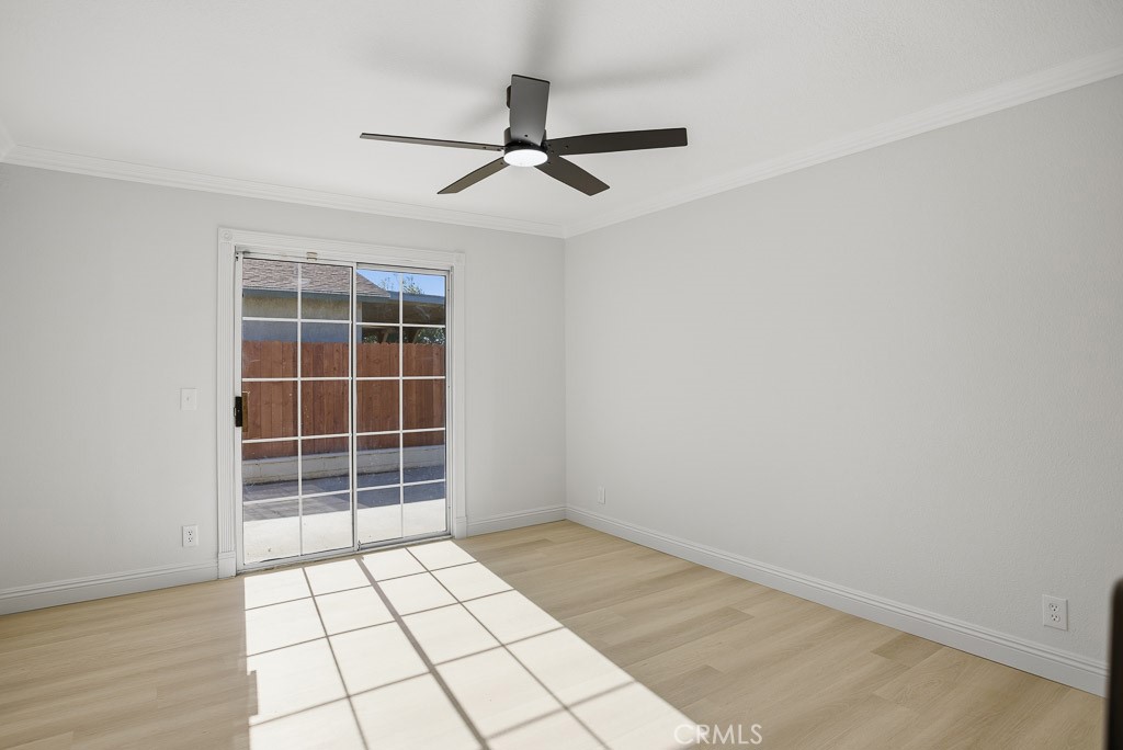 7051 Idyllwild Lane Riverside, CA 92503 - Photo 13 of 36 a view of empty room with wooden floor and fan