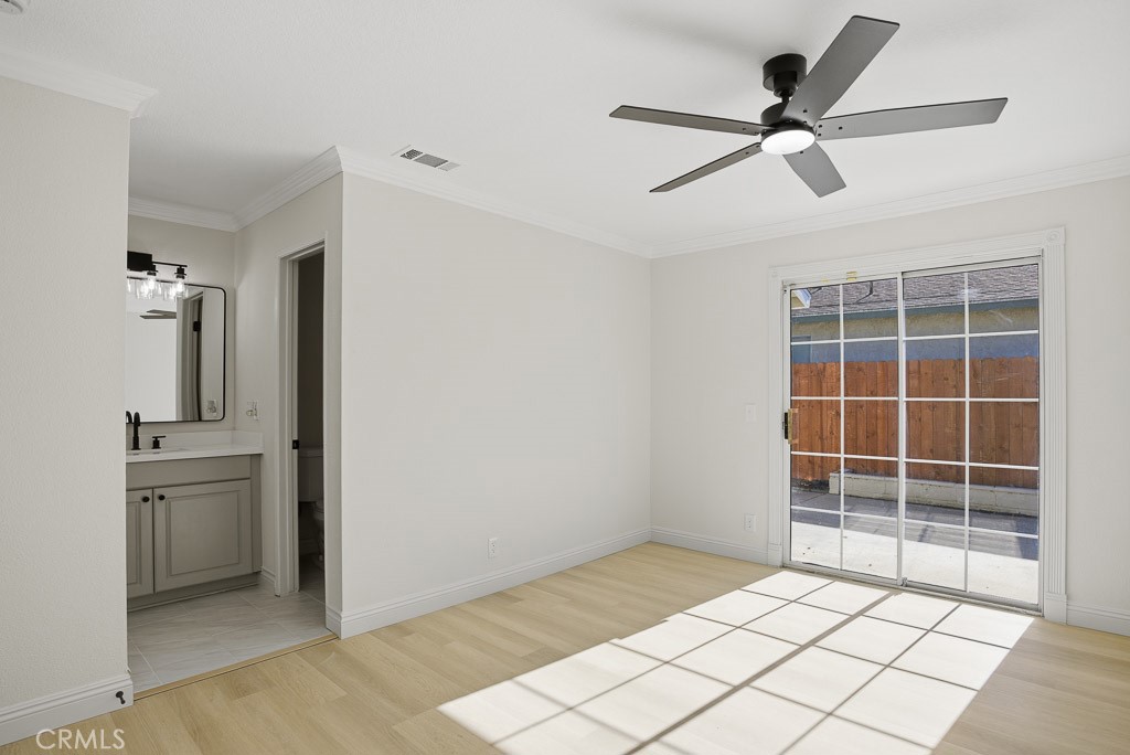 7051 Idyllwild Lane Riverside, CA 92503 - Photo 14 of 36 a view of empty room with wooden floor and window