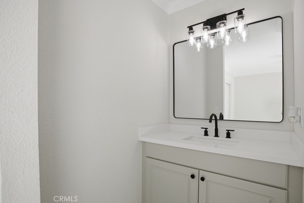 7051 Idyllwild Lane Riverside, CA 92503 - Photo 16 of 36 a bathroom with a sink and a mirror