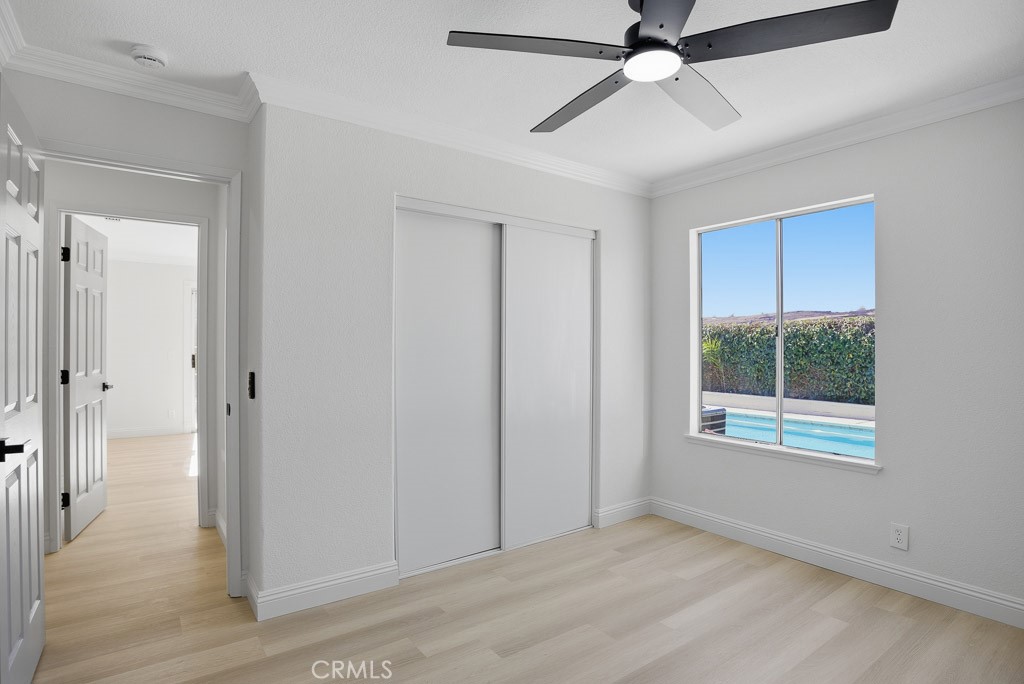 7051 Idyllwild Lane Riverside, CA 92503 - Photo 20 of 36 wooden floor in an empty room with a window