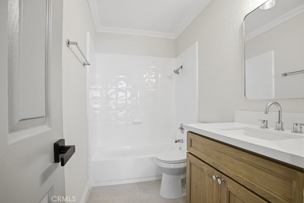 7051 Idyllwild Lane Riverside, CA 92503 - Photo 22 of 36 a bathroom with a sink a toilet and shower