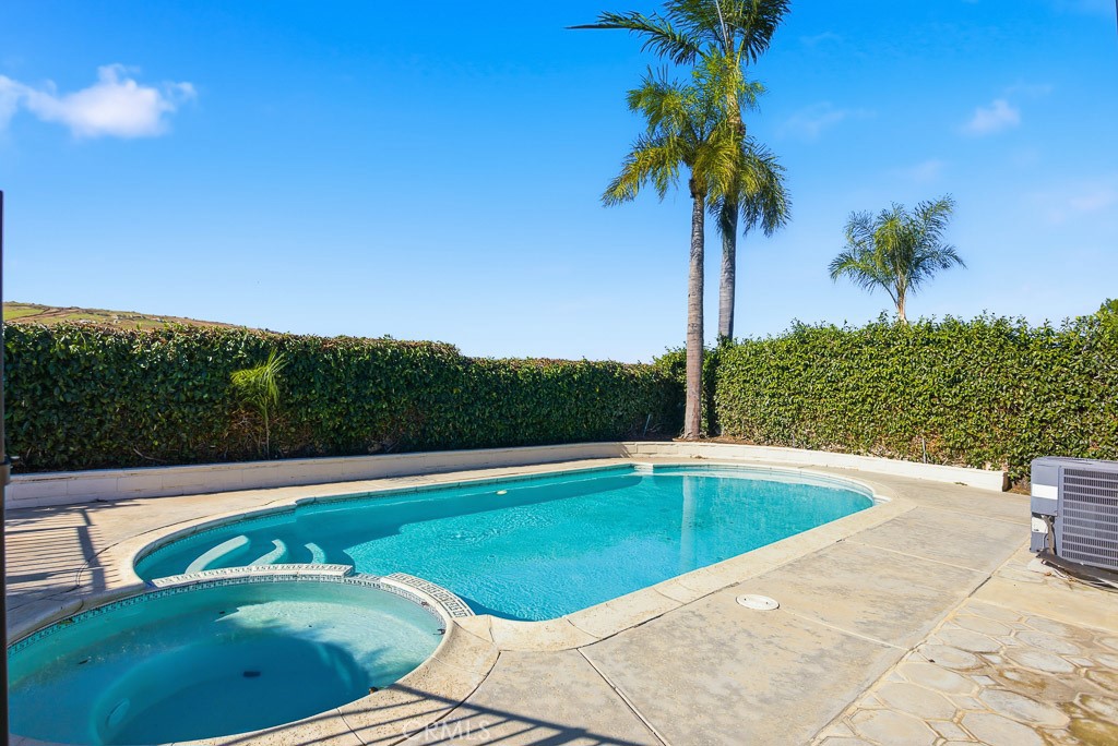 7051 Idyllwild Lane Riverside, CA 92503 - Photo 29 of 36 a view of a swimming pool and trees in the background
