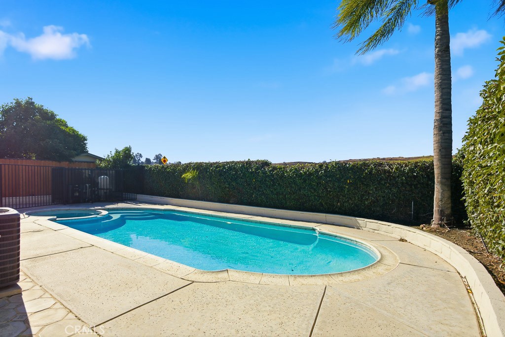 7051 Idyllwild Lane Riverside, CA 92503 - Photo 30 of 36 a view of a swimming pool with a yard