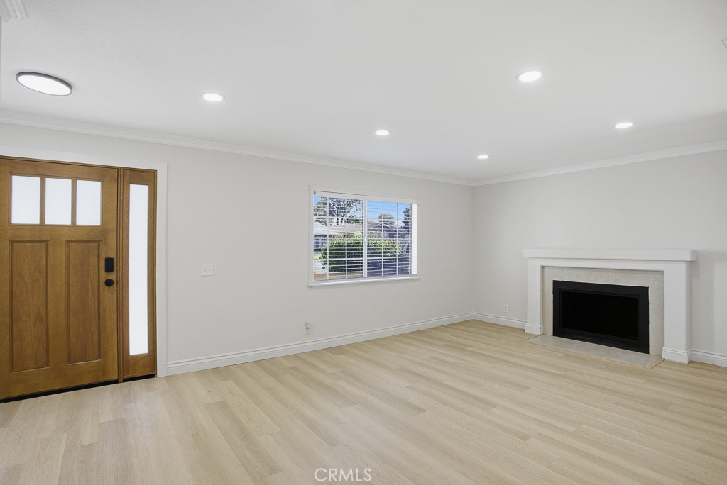 7051 Idyllwild Lane Riverside, CA 92503 - Photo 7 of 36 a view of an empty room with a window and fireplace