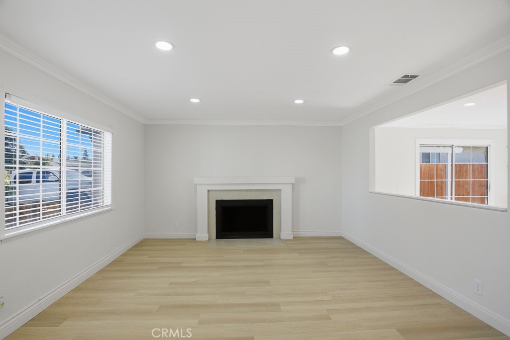 7051 Idyllwild Lane Riverside, CA 92503 - Photo 9 of 36 a view of an empty room with a window and fireplace
