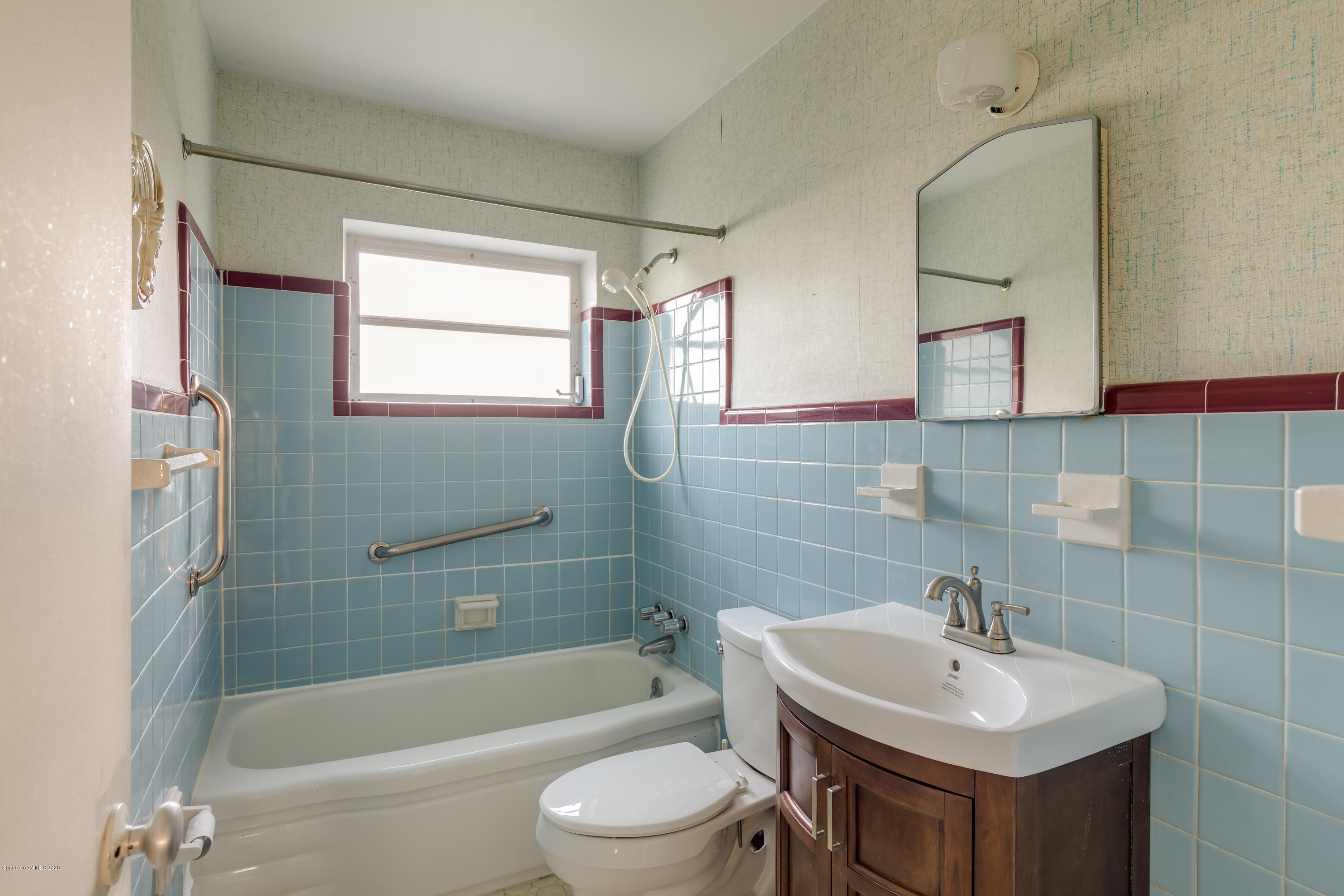 115 Cherry Street Melbourne, FL 32901 - Photo 8 of 12 a bathroom with a sink toilet and shower