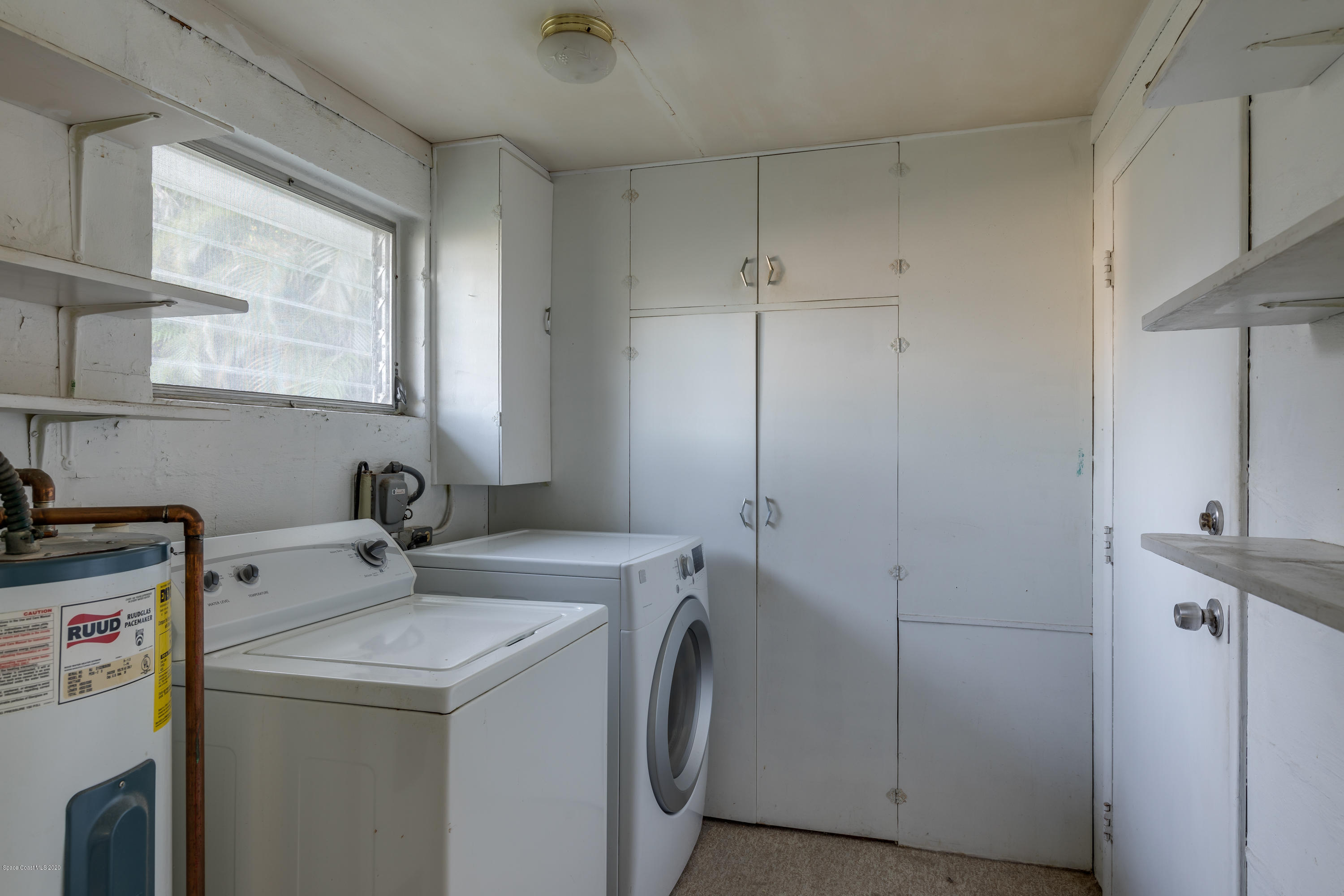 115 Cherry Street Melbourne, FL 32901 - Photo 10 of 12 a utility room with dryer and washer