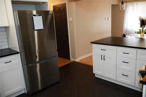 a kitchen with appliances and cabinets