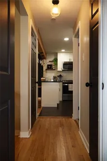 a view of a kitchen from the hallway