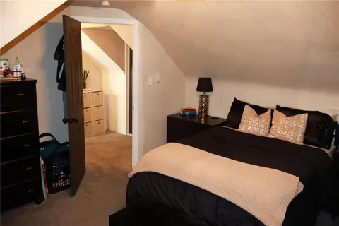 a bedroom with a bed and a closet