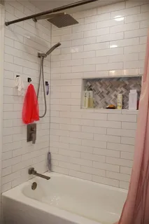 a bathroom with a shower and a tub