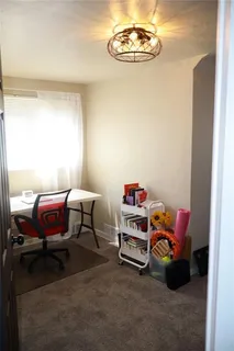 a room with a bed and a chandelier