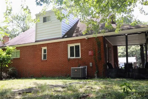 a view of a backyard of the house