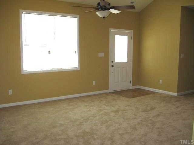 2529 Friendly Trail Raleigh, NC 27610 - Photo 4 of 12 an empty room with a window